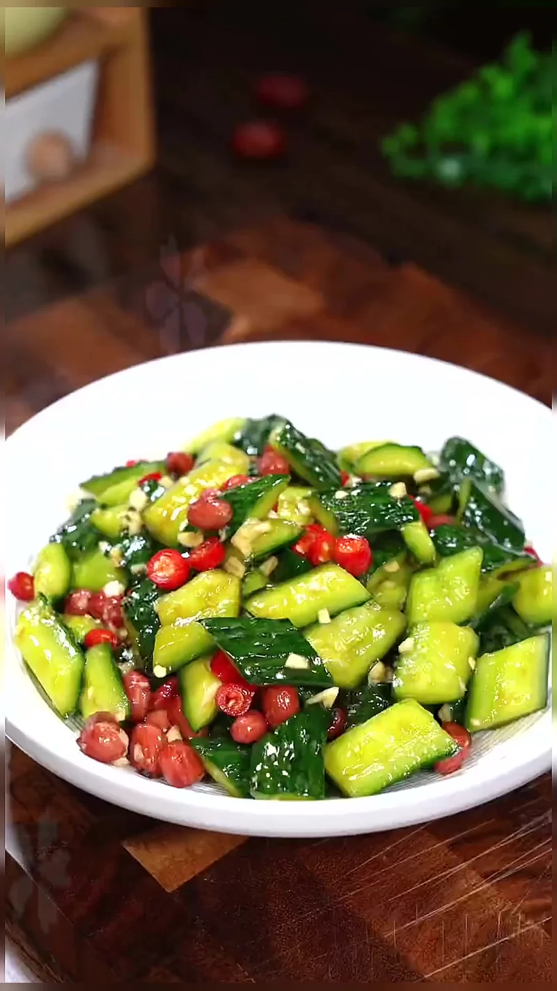 Garlic-smashed cucumber salad with peanuts and chili, a classic Beijing cold appetizer served before lamb spine hotpot.