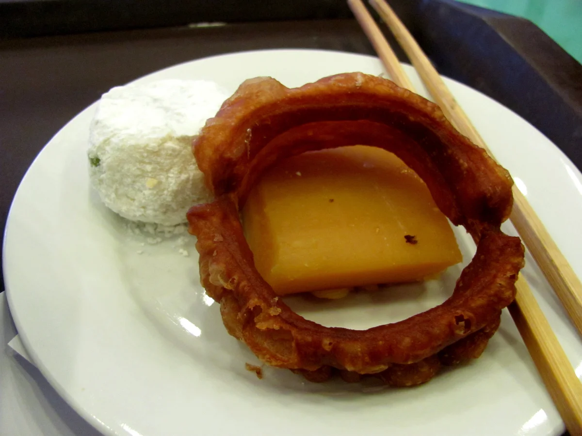 Old Beijing snack plate with jiaoquan in a broader snack shop setting