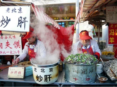 Old Beijing chaogan stall with steaming pots and street breakfast service