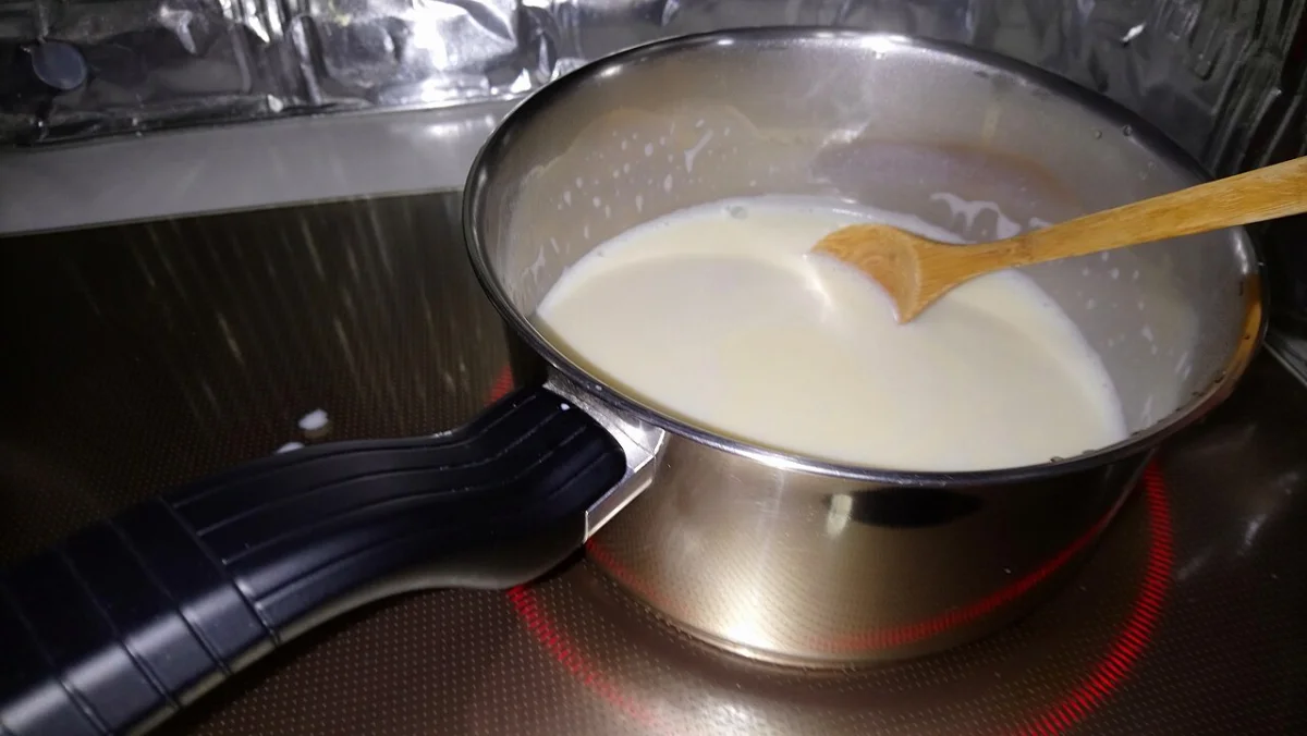 Soy milk being heated as part of the soft tofu pudding preparation process