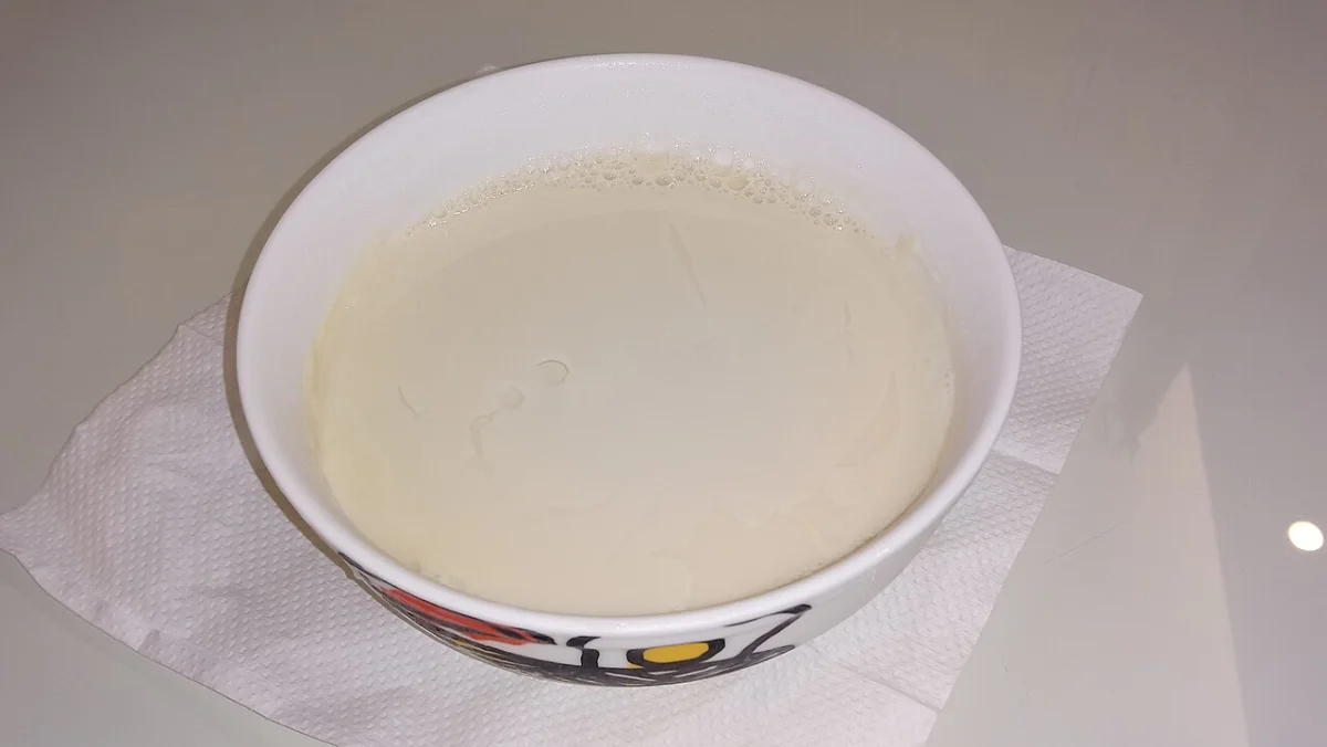 Plain soft soy pudding showing the delicate texture before savory gravy is added