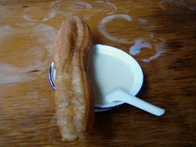 Soy milk served with youtiao as a mild Chinese breakfast comparison