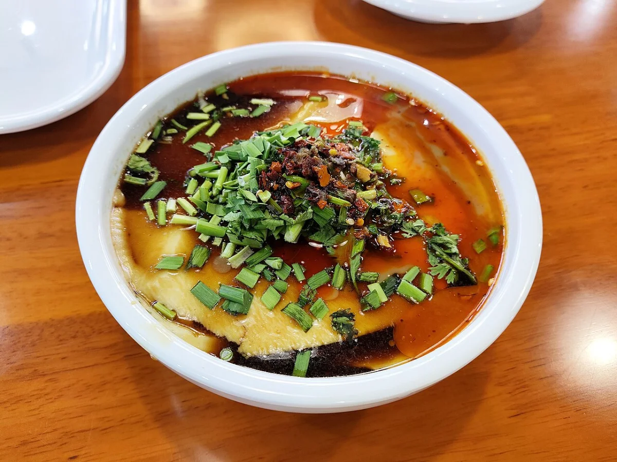 Northern-style laodoufu with soy sauce base, cilantro, and chili oil for texture comparison