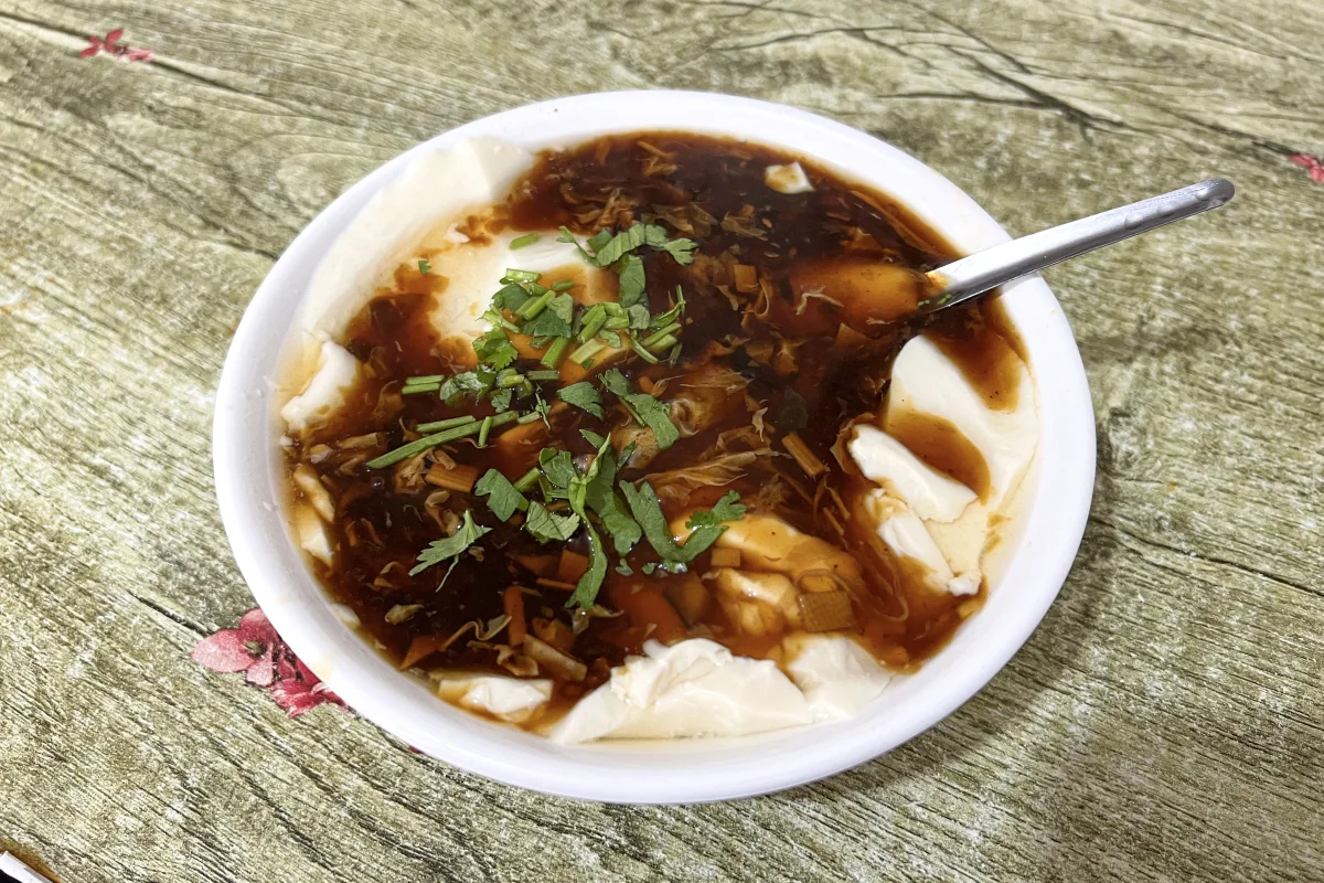 Beijing doufunao breakfast bowl with toppings and pairing options