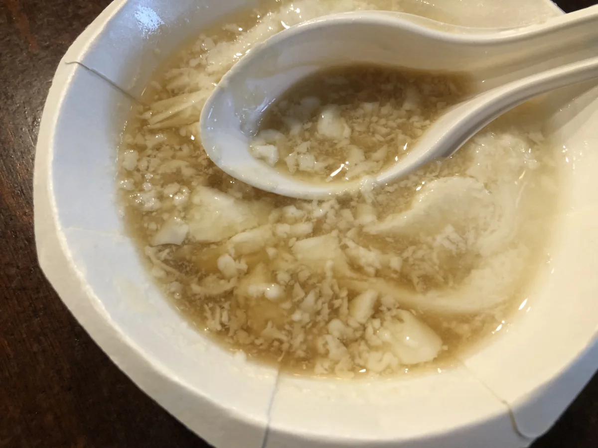 Peanut douhua showing a sweeter tofu pudding style outside Beijing breakfast