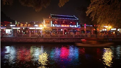 Shichahai snack street at night, an old Beijing food area with baodu shops nearby