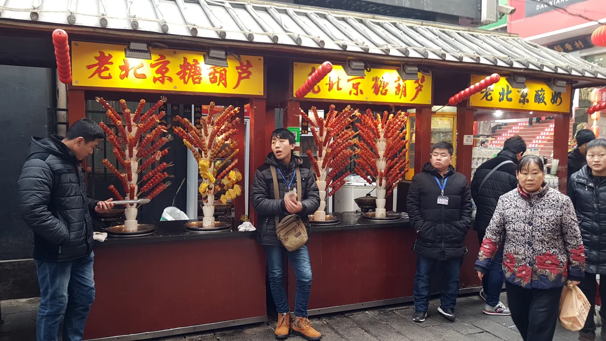 Beijing snack street food stalls showing the broader street-food context of baodu