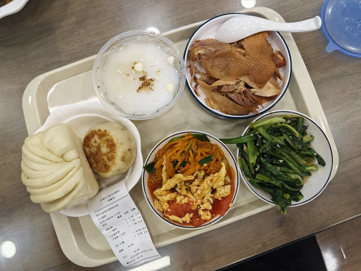 Beijing snack meal tray with men ding rou bing and side dishes at Huguosi snack shop