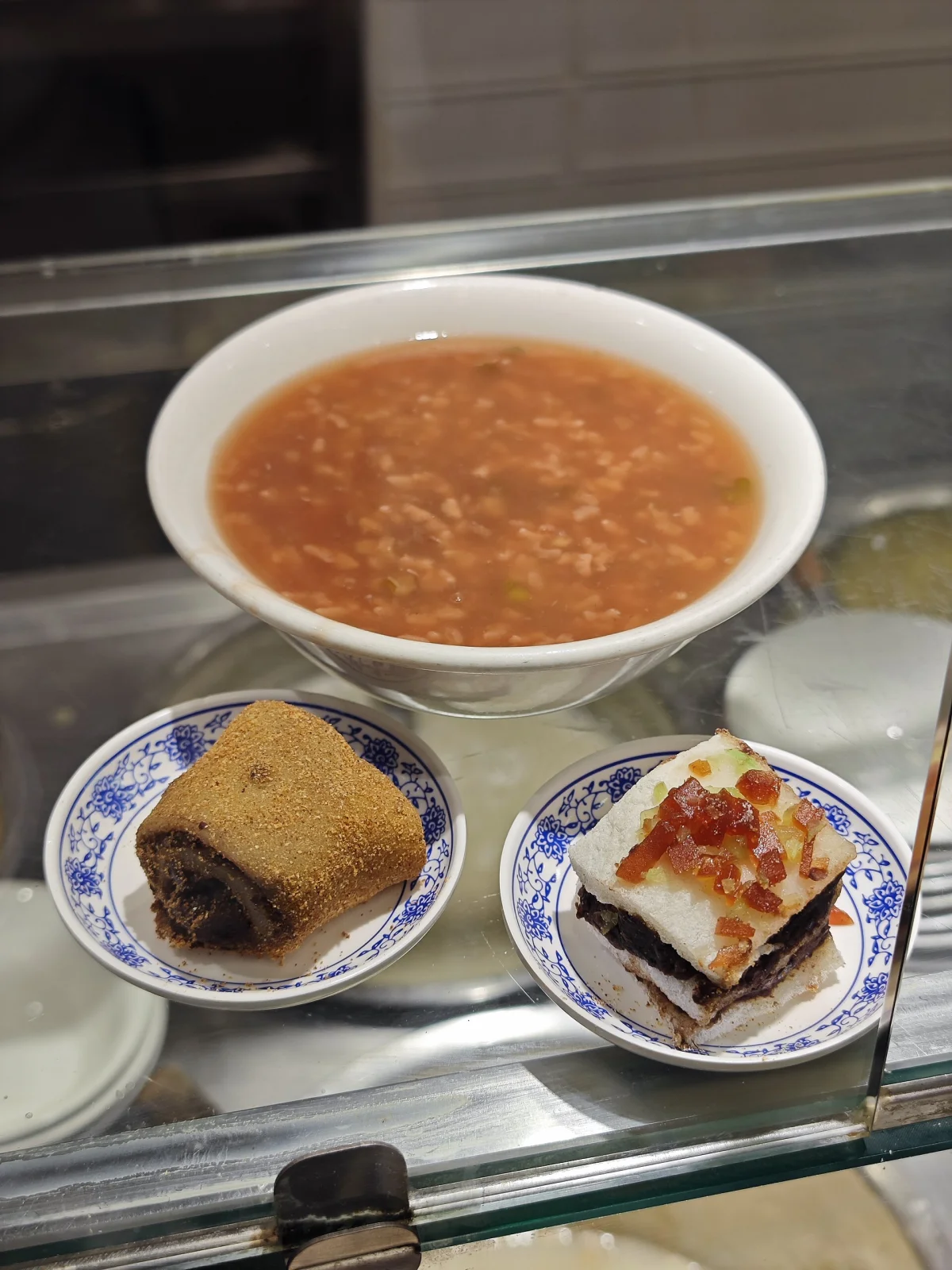Lvdagun displayed at a Huguosi snack counter beside other traditional Beijing foods