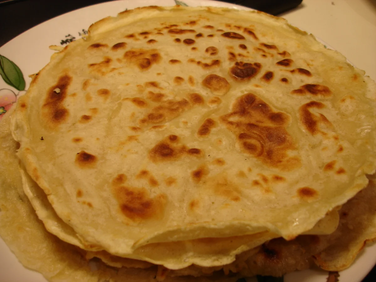Thin pancakes served alongside Jing Jiang Rou Si