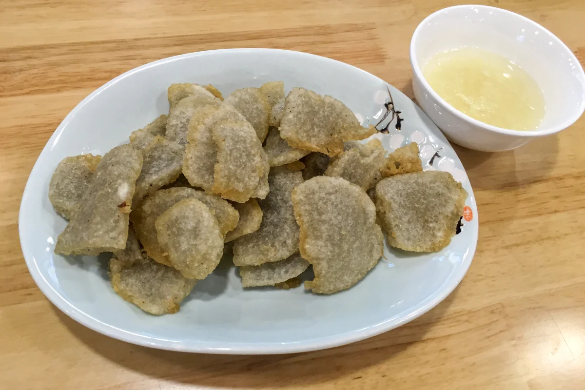 Plate of fried guanchang with garlic water at a Huguosi Street restaurant in Beijing