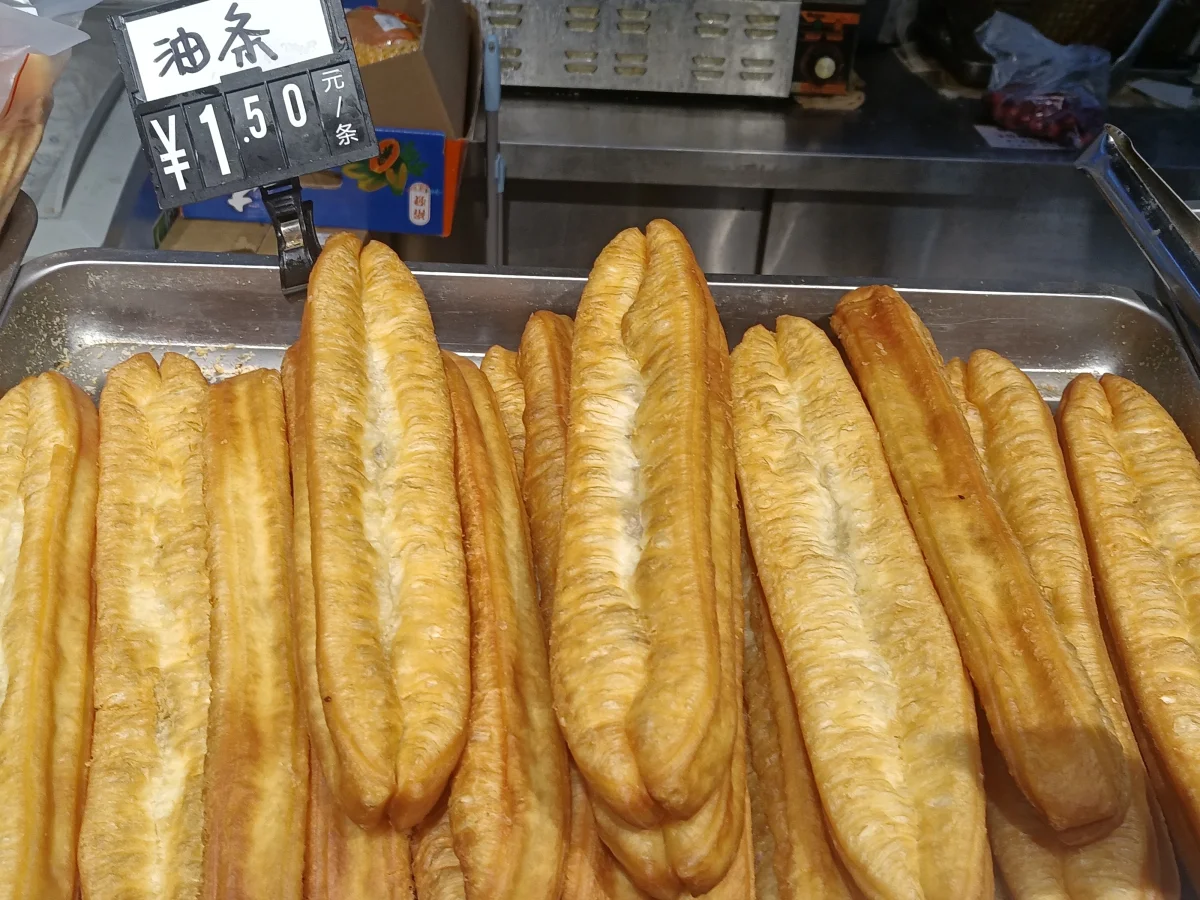 Fresh fried Chinese crullers arranged in a basket
