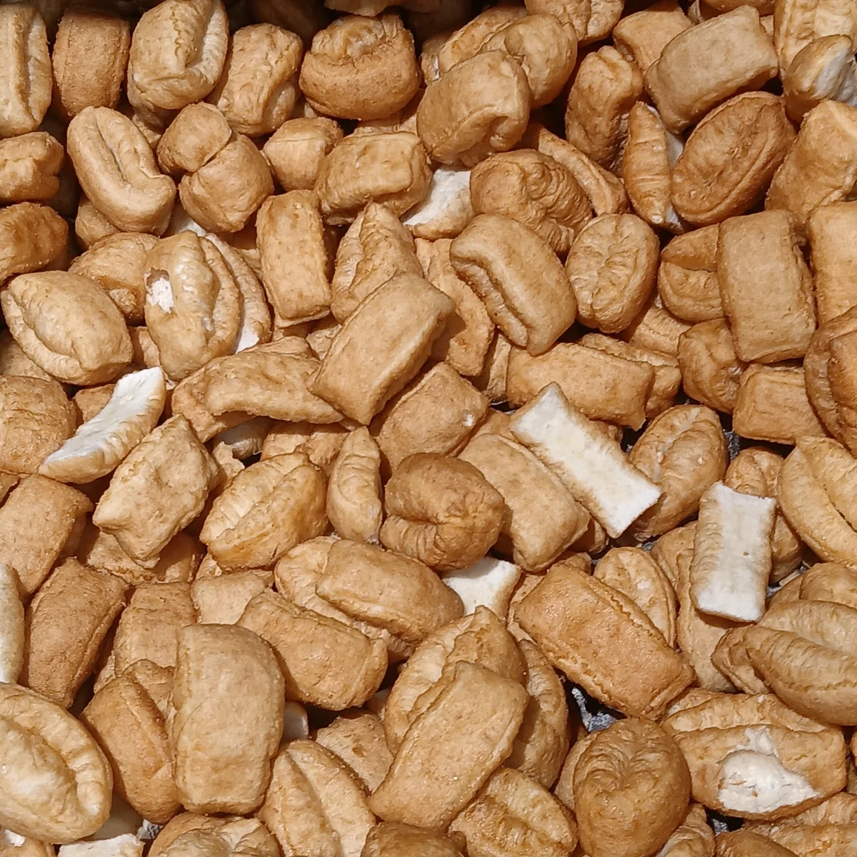Small golden Chinese crullers, showing the fried dough texture from above.