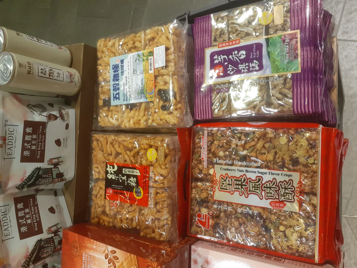Several packaged sachima products displayed together as take-home pastry options.