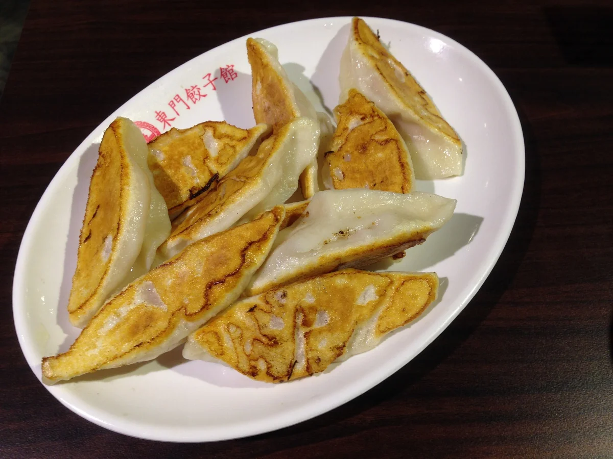 Pork potstickers showing deeply browned bases at Dongmen Dumpling House in Taipei