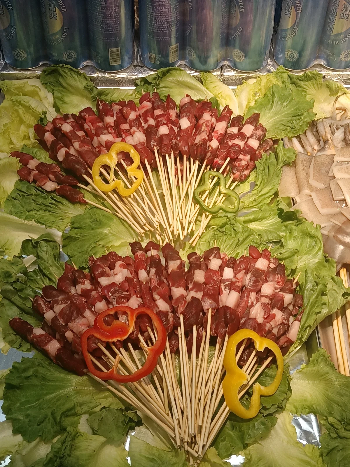 Uncooked lamb skewers on display at Freshippo before grilling